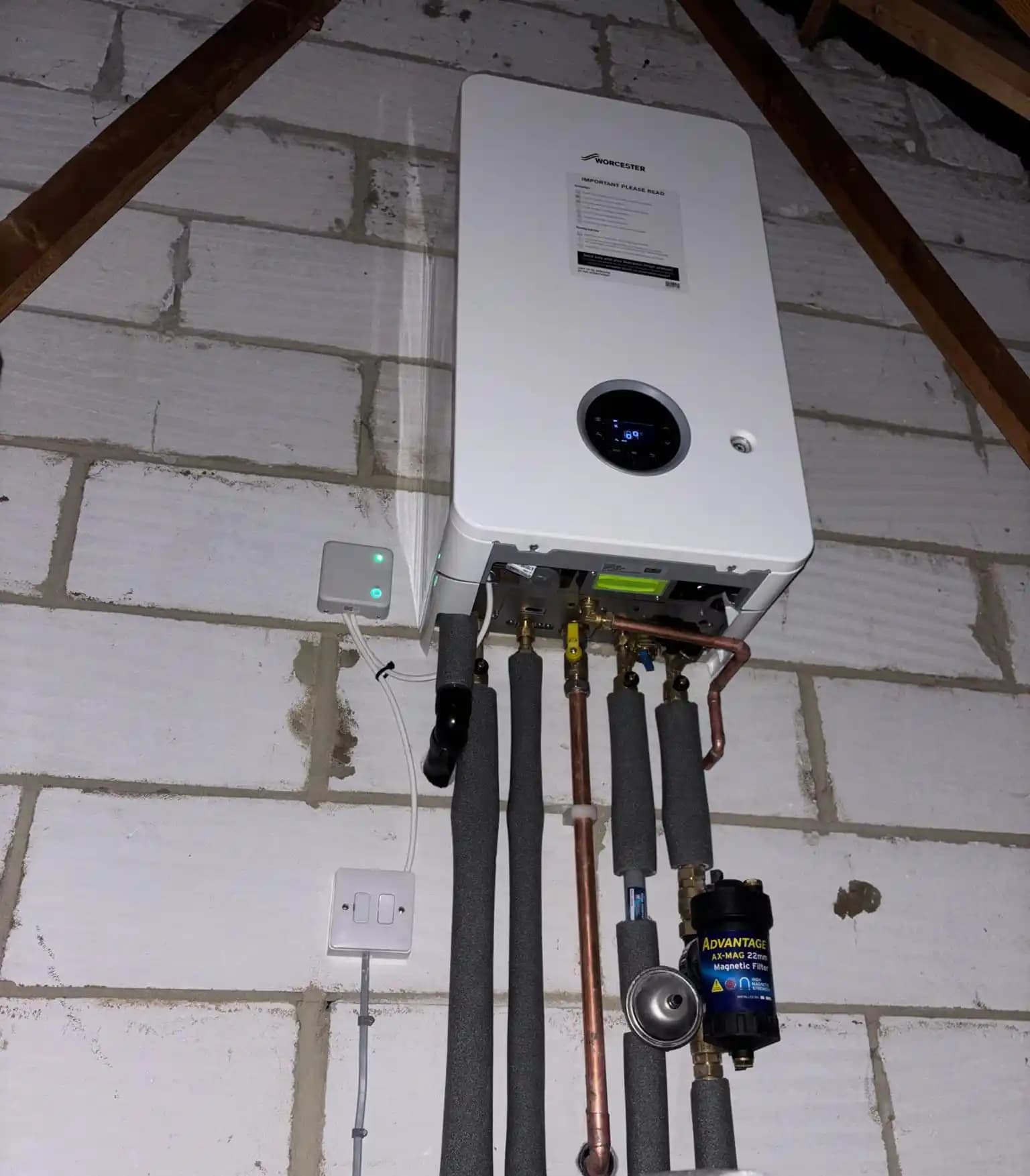 Worcester boiler installed with insulated pipework and a magnetic filter.